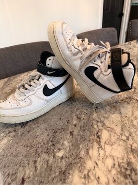 Nike White High-Top Sneakers with Black Swoosh